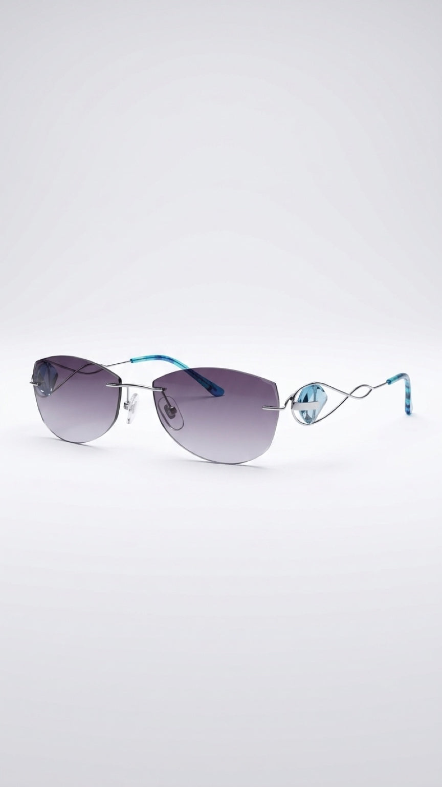 Rimless sunglasses with gradient gray lenses, a thin silver metal frame, and light blue temples, shown on a light gray background.