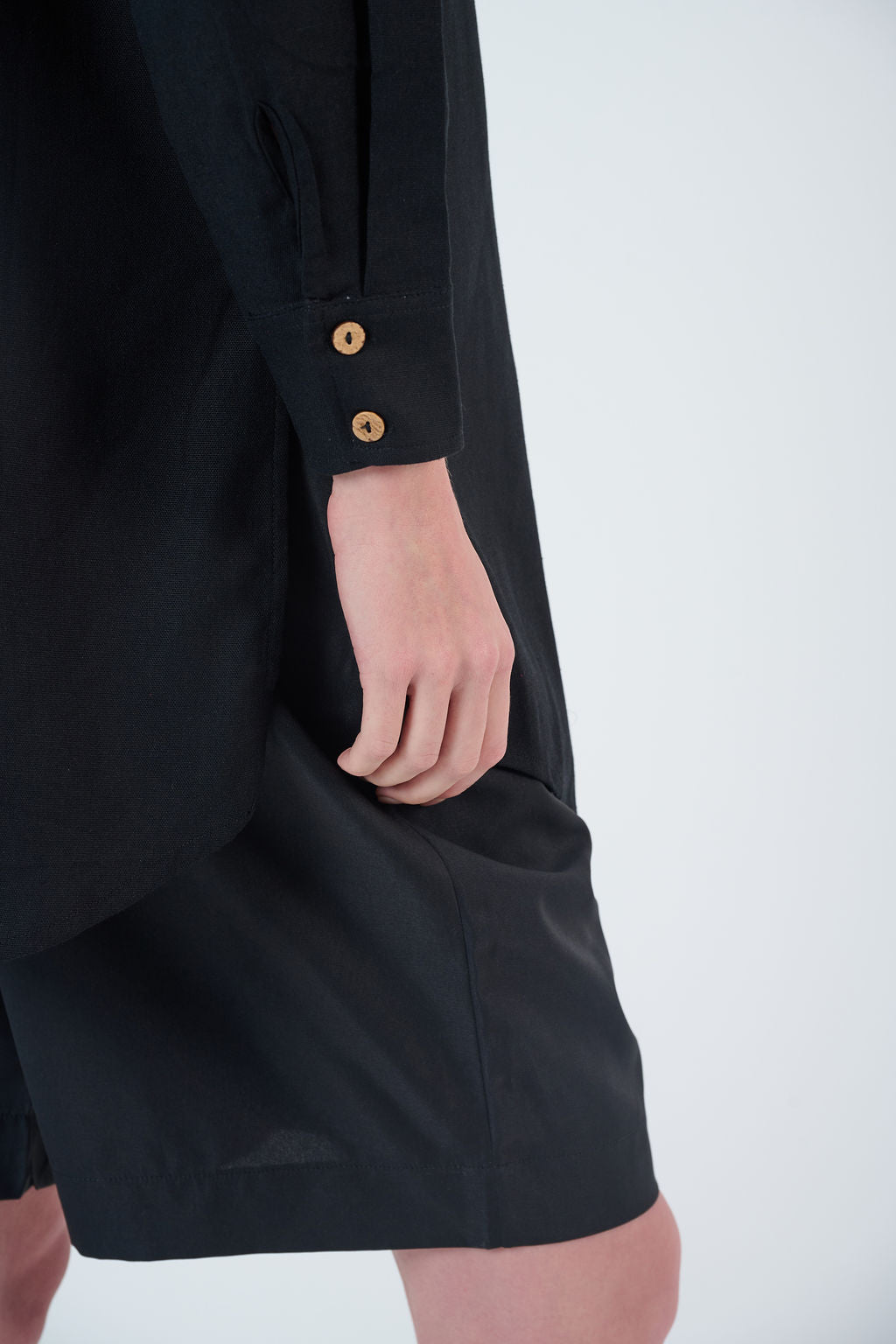 Close-up highlighting tailoring, zipper finish, and fabric texture