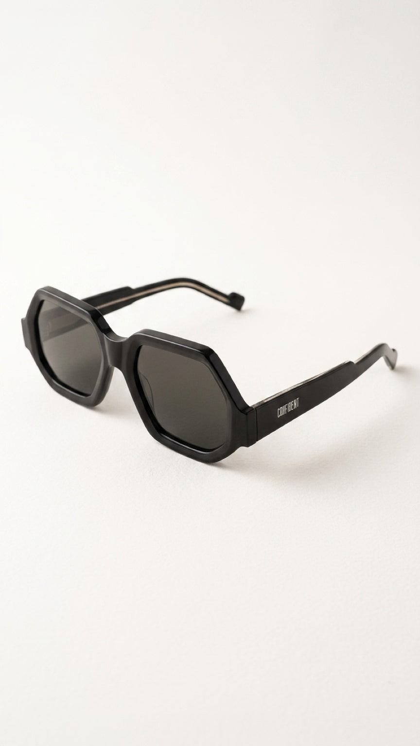 Black geometric sunglasses with dark lenses and a visible 'Dior' confident logo on the temple arm, photographed on a clean white background.