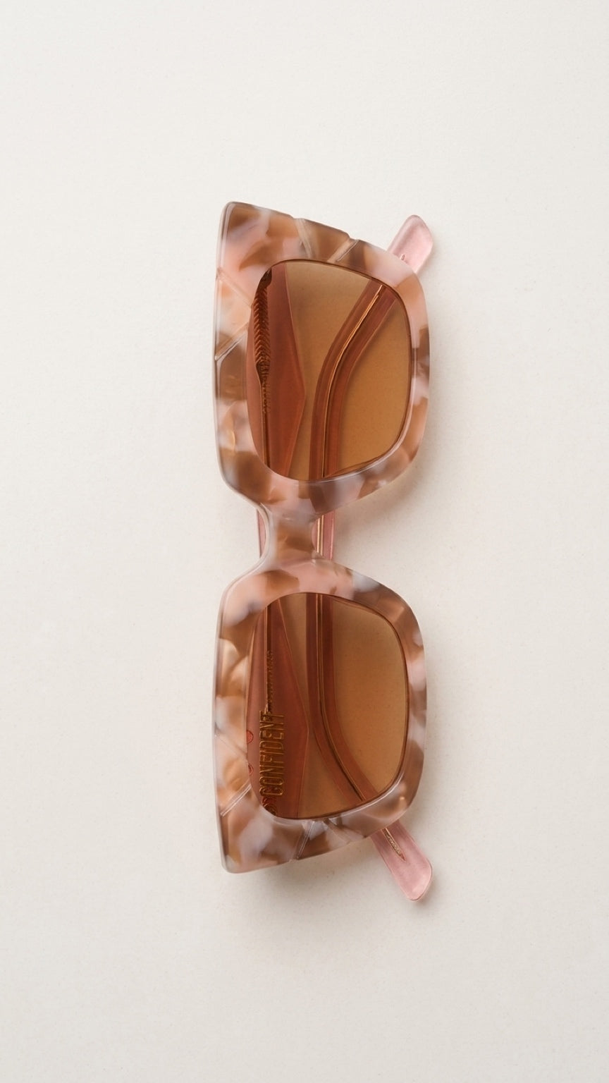 Top view of folded CONILVARO pink tortoiseshell-effect square sunglasses with brown gradient lenses