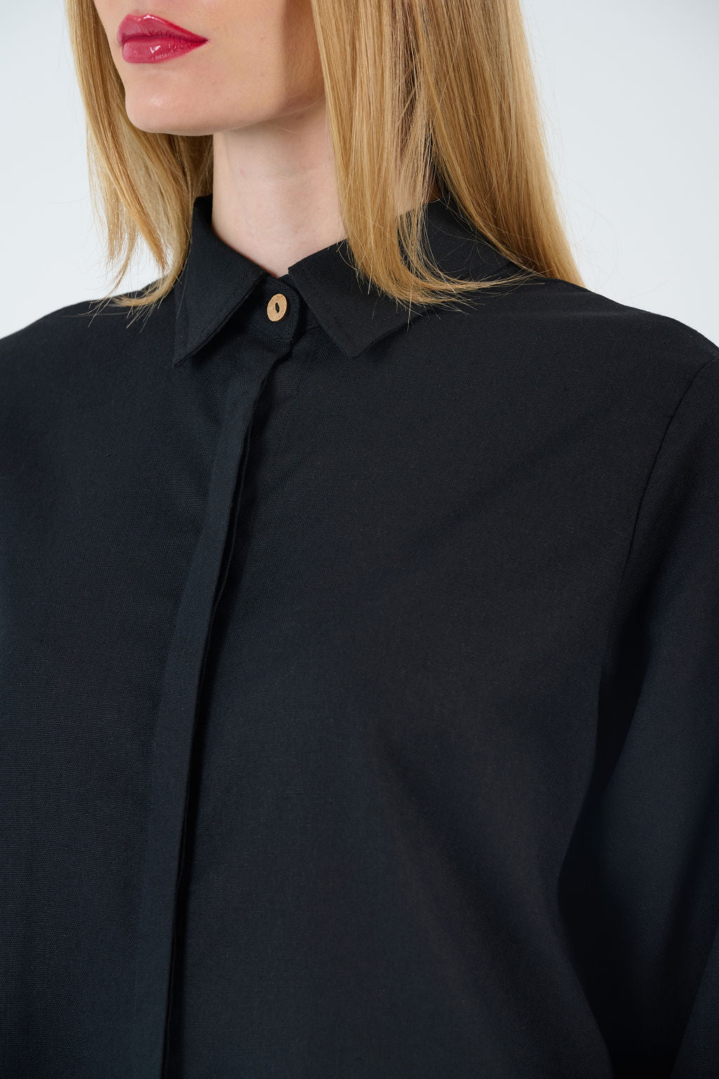 Close-up highlighting tailoring, zipper finish, and fabric texture