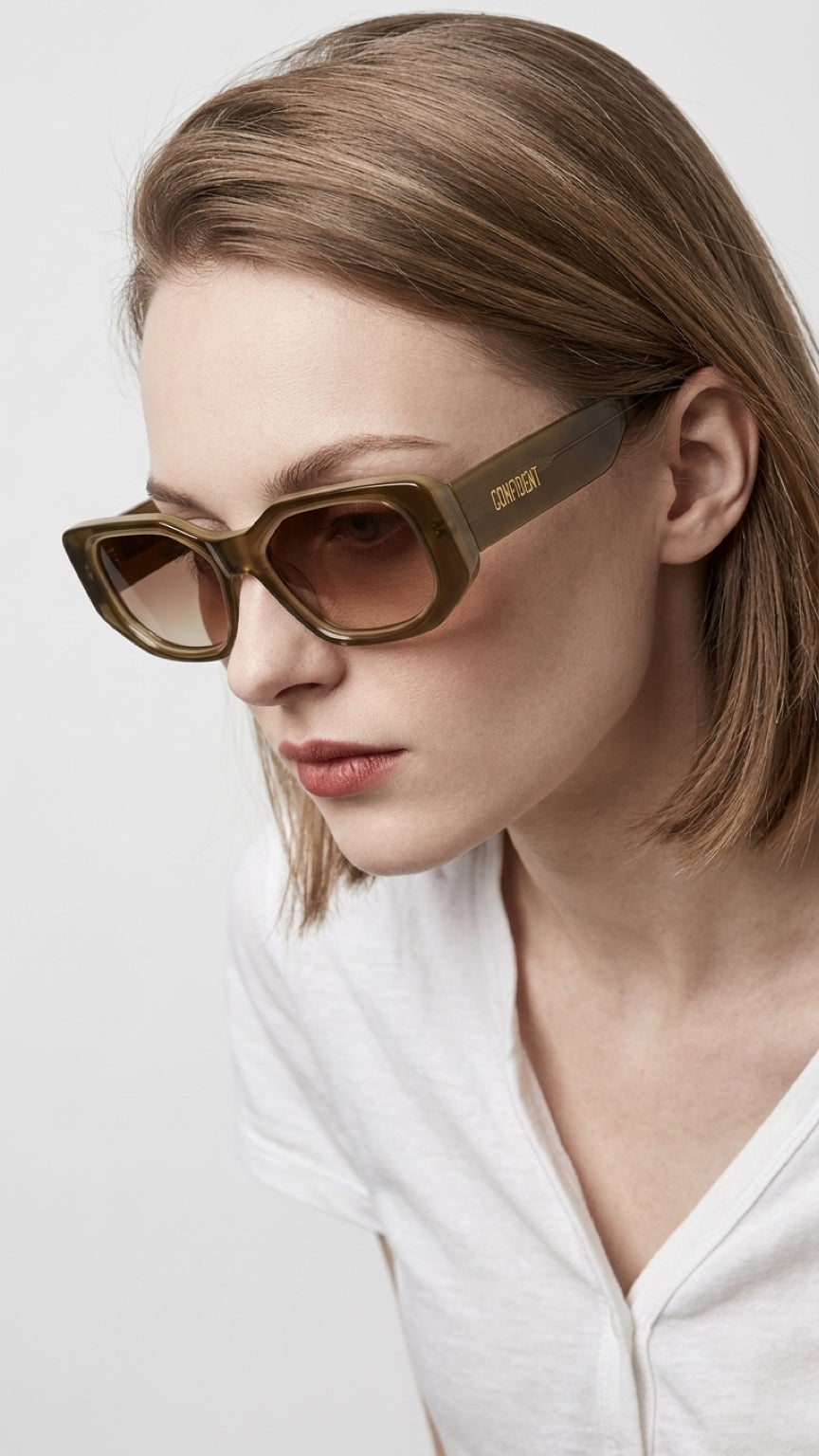 Side view of woman wearing CONFILVARO brown tortoiseshell-effect rectangle sunglasses