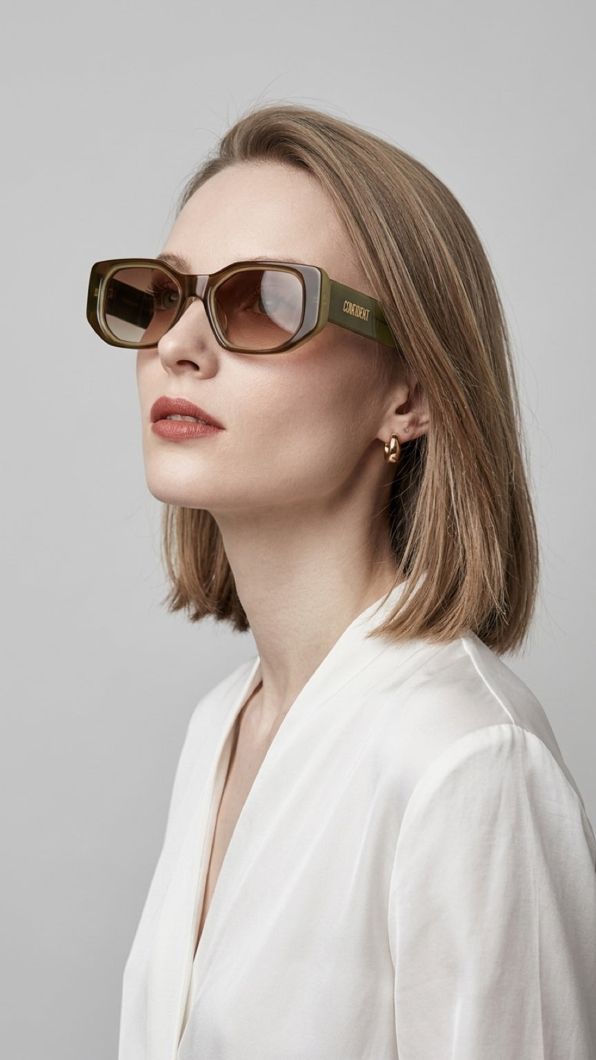 Profile view of woman wearing CONFILVARO brown tortoiseshell-effect rectangle sunglasses
